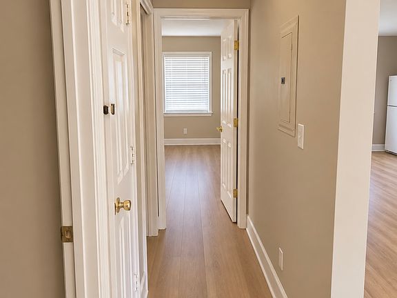 Hallway with storage closet