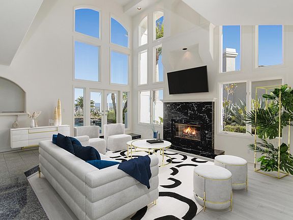 VIRTUALLY STAGED representation of living room. Home is unfurnished.