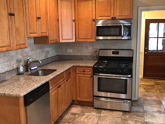 Brand new kitchen with gas range and granite