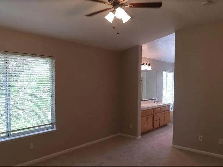 entry to master bathroom through master bedroom.