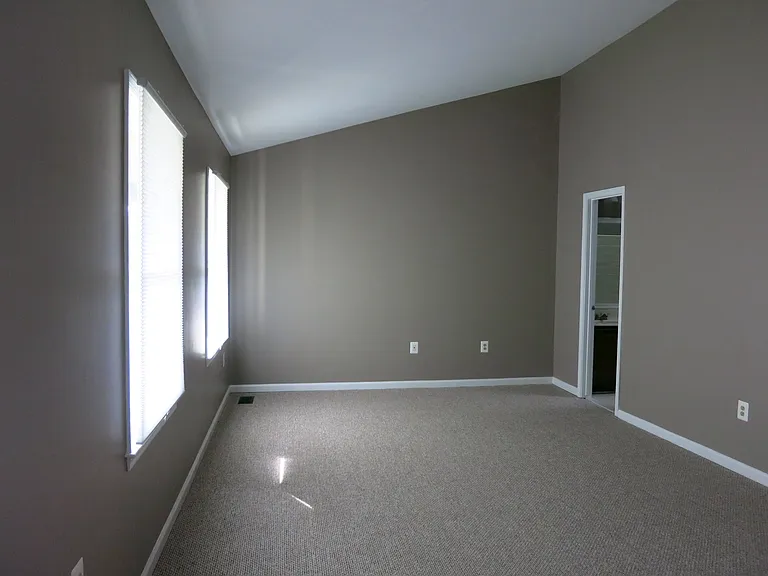 Master bedroom with vaulted ceiling