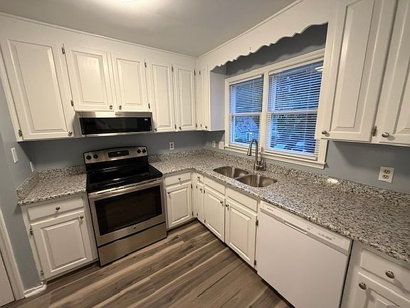 Kitchen - new countertops and over range microwave.