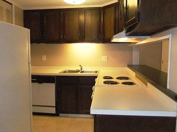 Kitchen with breakfast bar and all appliances stay.