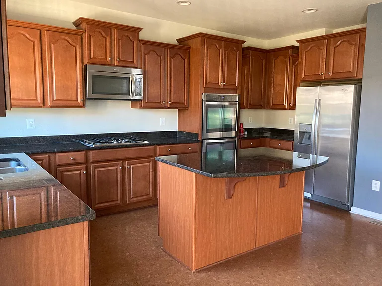 Upgraded kitchen with SS appliances and granite counter tops.