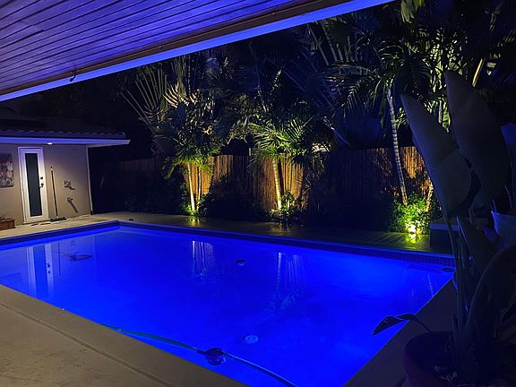 Pool at night, outdoor bathroom and shower
