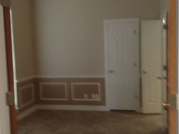 Formal dining with large front window, recessed lighting, ce