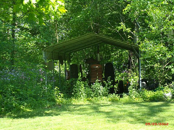 Carport behind garage