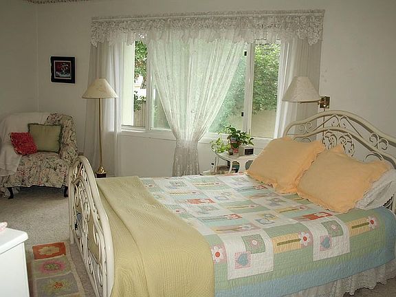 Master bedroom has a large walk-in closet and view of the woods