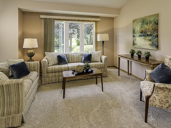 Vaulted ceilings and large windows give the main floor living area a bright and airy feel.