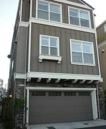 Back of building with 2-car garage