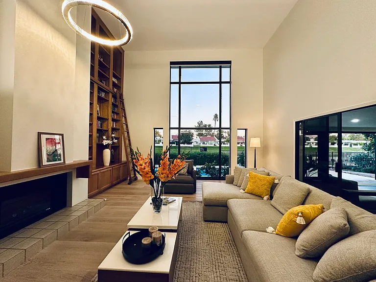 Breathtaking living space defined by soaring, double-height ceilings and big windows blending the indoors with the stunning natural beauty outside.