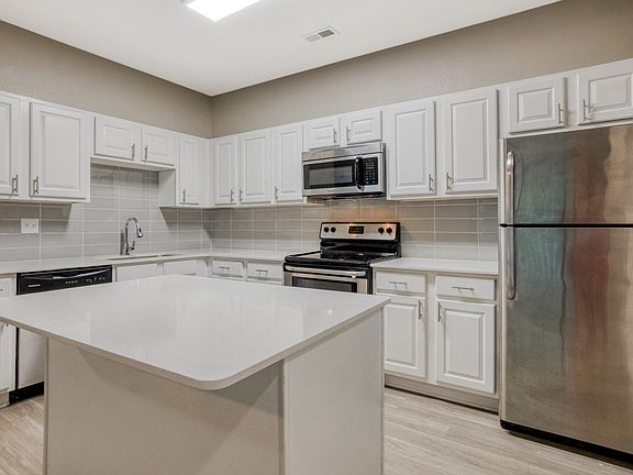 Quartz countertops and stainless steel, energy efficient appliances