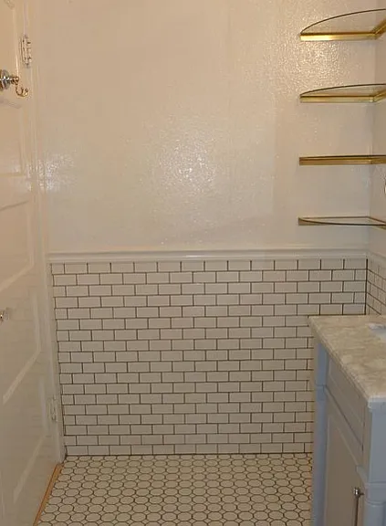 Bathroom shelving with tiled walls and floors