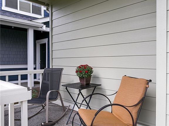 Covered entry porch provides relaxing place to sit and enjoy the surroundings.
