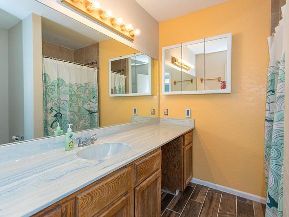 Master bath with radiant floor heat. Tile shower.