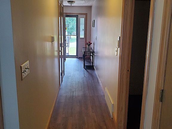 Hallway with 3 closets