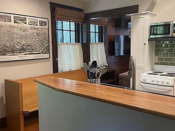 Updated kitchen - with all you need to warm a pizza or bake a cake.