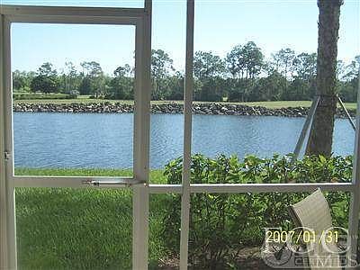VIEW OF LAKE & GOLF COURSE FROM SCREENED IN BACK LANAI...