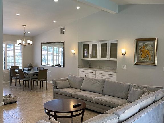 Living Room ? Dining Area and a Built - In Bar with Carrara Marble