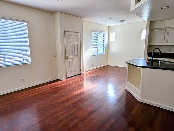 Cherry wood flooring in living and dining area.