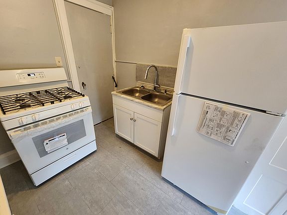 Kitchen Prep and Cooking Area - New Appliances (Range/Stove & Refrigerator) and New Sink and Fixtures