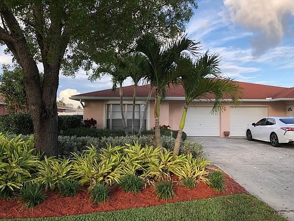 Unit 2 / Left Side: single car garage with extra parking.
