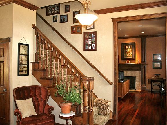 Beautiful entrance to home with office on right and formal living on left.