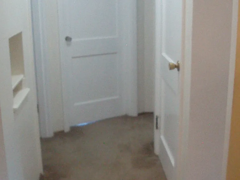 Hallway to bedrooms, bath, and basement