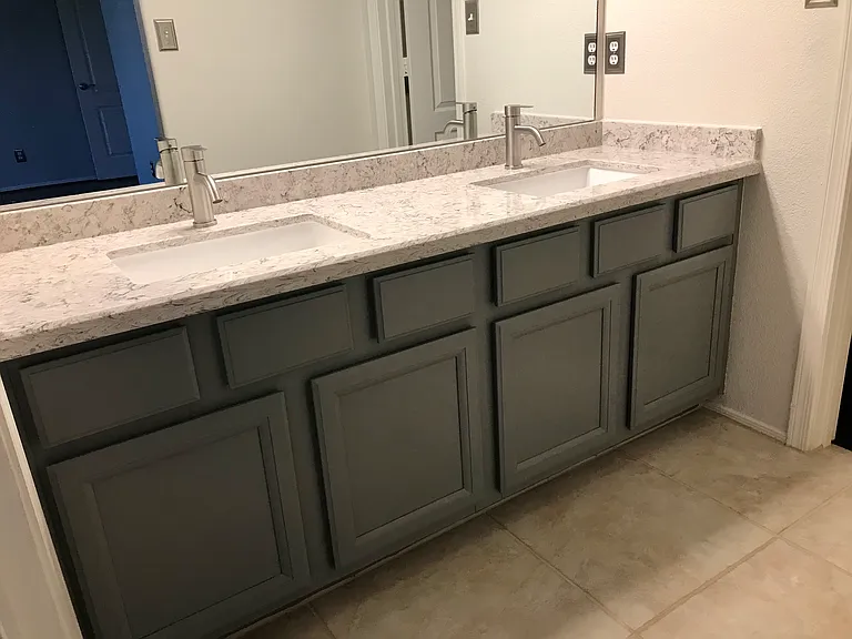 Master bedroom bathroom has double vanity, quartz countertop with updated sinks and faucets (Brand new fully tiled walk-in shower and new toilet in July 2026! - picture will be added when completed).