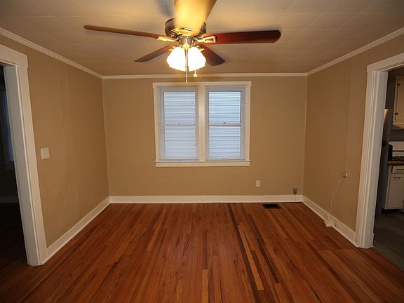 Large windows let in lots of natural light. All windows include blinds so buying and hanging curtains is optional.