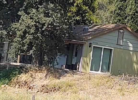 Front of property, shared front deck/laundry