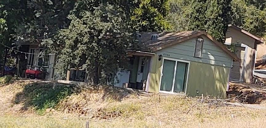 Front of property, shared front deck/laundry