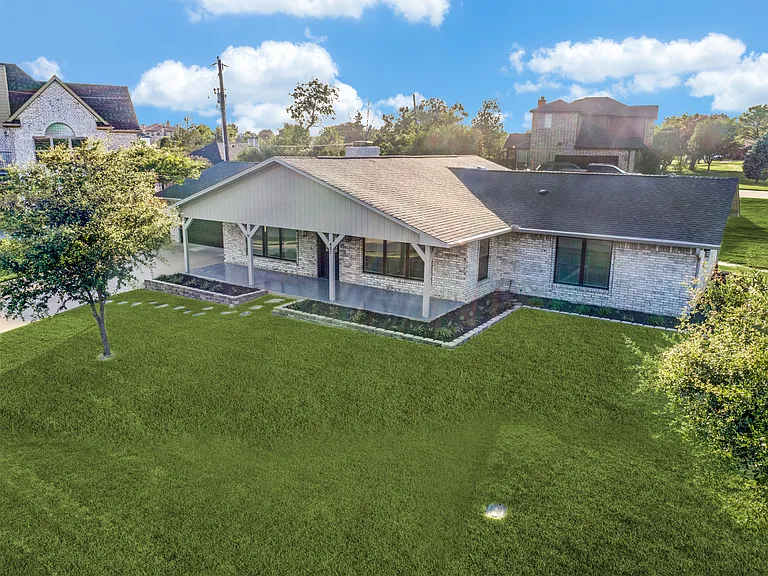 Huge covered front patio featuring beautiful sunrises over Lake Lewisville!
