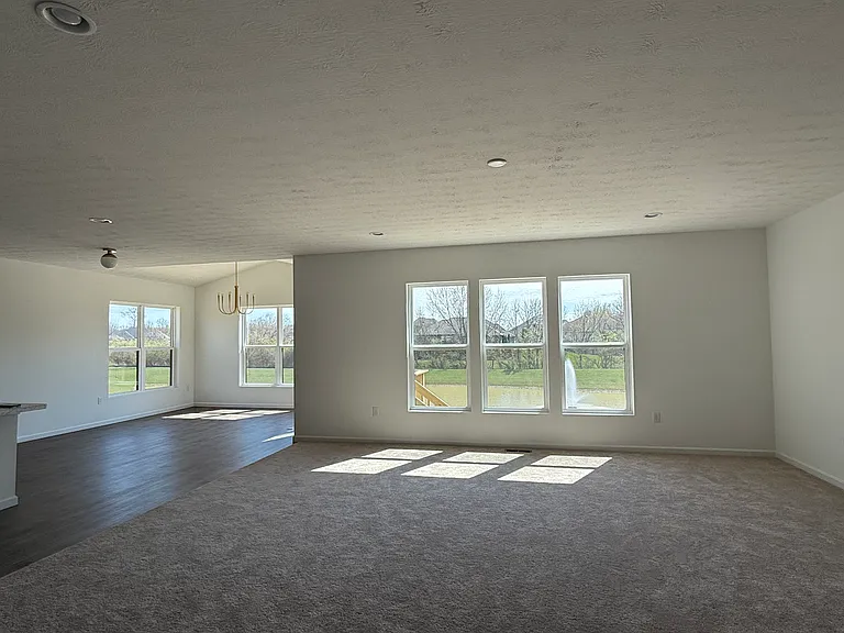 Open concept living room (blinds not shown in picture, but have now been installed on all windows)