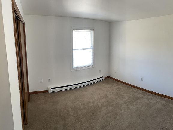 bedroom (12x11) carpet and large double door closet