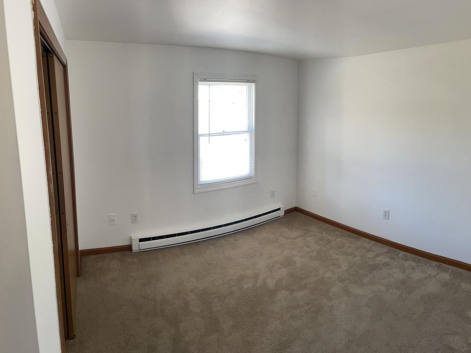 bedroom (12x11) carpet and large double door closet