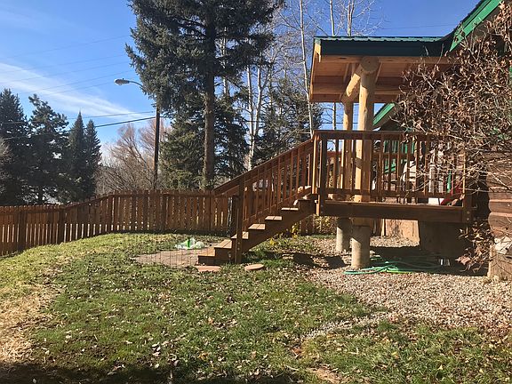 Covered front porch with 2 chairs