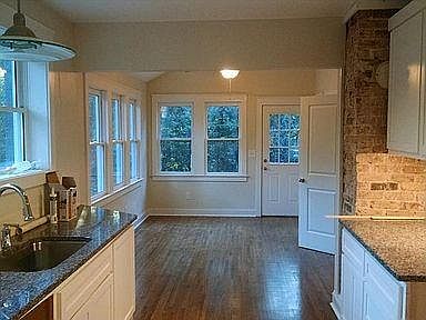 Kitchen and eating area(laundry hookup in closet) with back deck overlooking Brownwood Park
