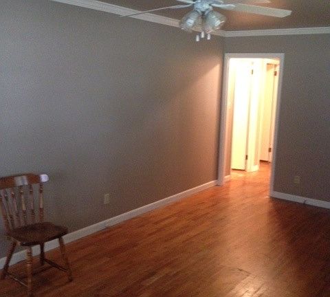 View from LR to hallway. New paint and refinished hardwood