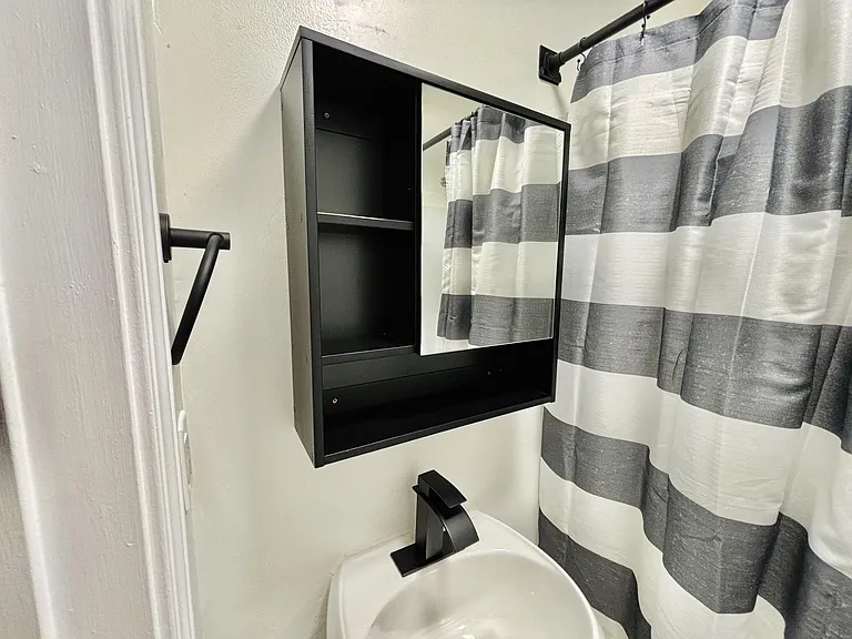 Shared upstairs hallway bathroom with tub and shower combo