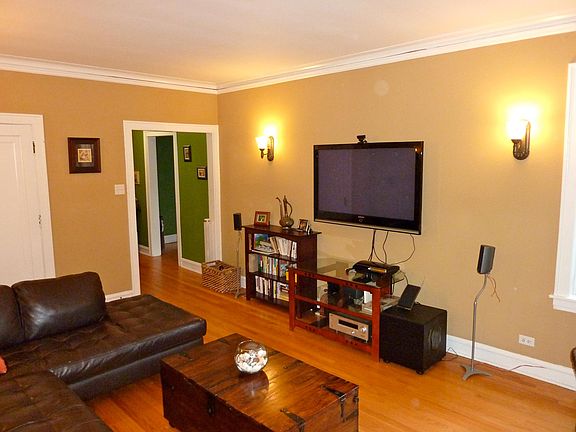 Furnished living room was repainted in neutral light color