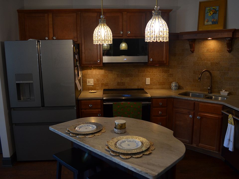 Island with storage and quartz top matching kitchen counters