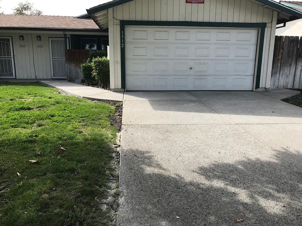 Duplex exterior - new private driveway, attached 2-car garage