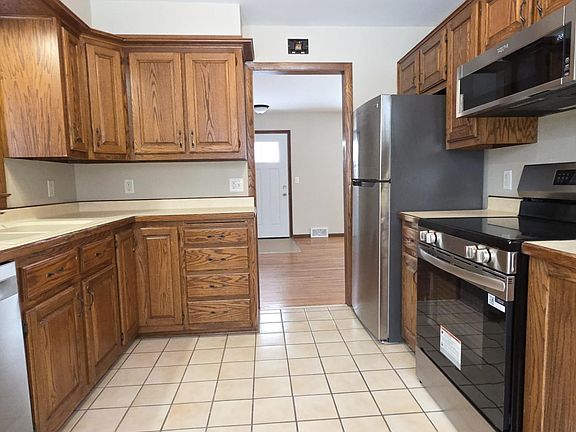 Solid oak cabinets and plentiful counter space.