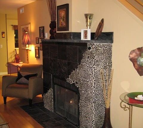 Living room fireplace- granite, slate & pebble rocks
