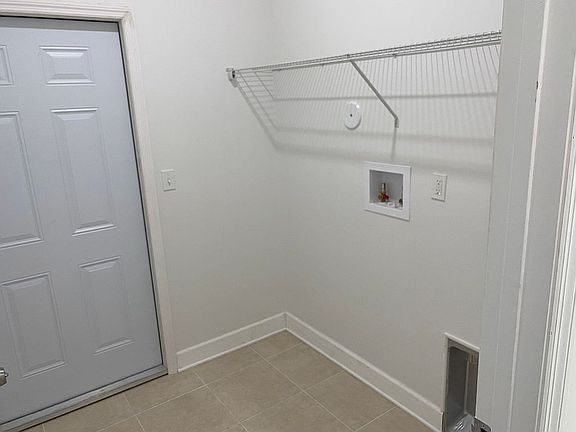 Laundry room near garage 