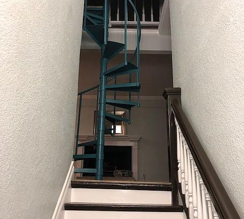 View to 2nd floor and spiral staircase to 3rd floor bedroom