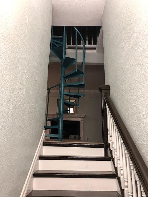 View to 2nd floor and spiral staircase to 3rd floor bedroom