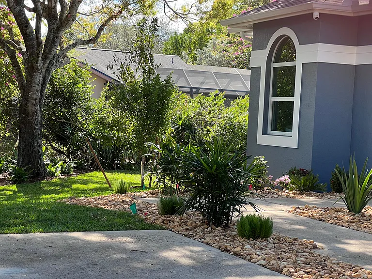 Side yard access to open grass area and pool