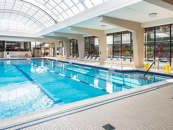 Indoor/Outdoor Pool Ceiling Opens During the Summer & Closes During Winter! Olympic Size Pool!